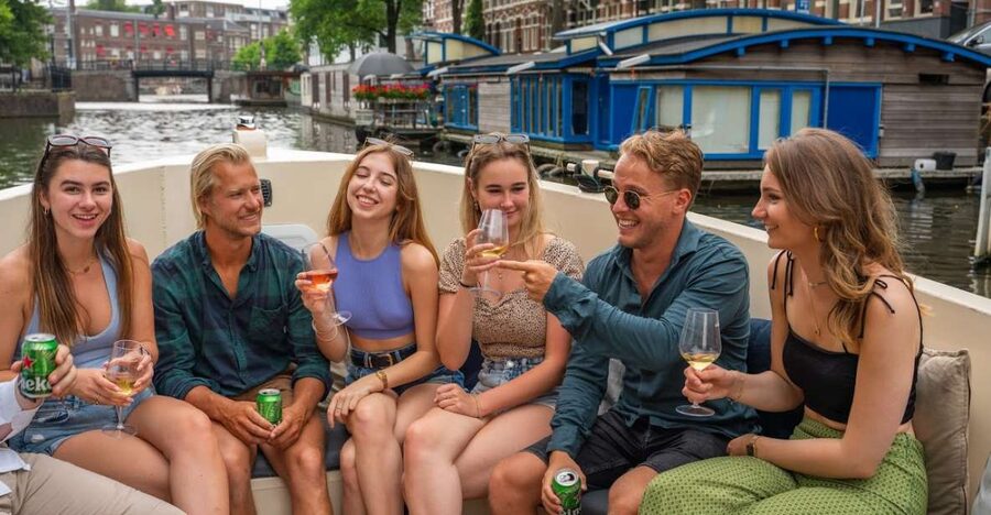 Amsterdam: Red-Light District Pub Crawl and Booze Boat Tour - Starting with shots at The Black Tiger Bar