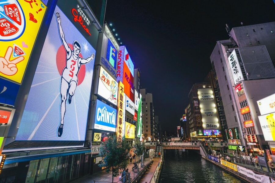 Osaka: Bar-Hopping Night Tour in Namba - Dotonbori’s Glico sign and the shift to Ura-Namba